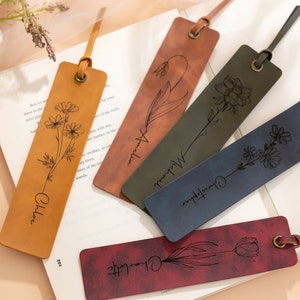 May include: Five leather bookmarks with floral designs and personalized names. The bookmarks are in shades of brown, red, blue, and green.