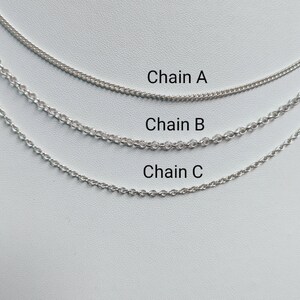 May include: Three silver chains of different lengths and thicknesses labeled "Chain A", "Chain B", and "Chain C" on a white background.