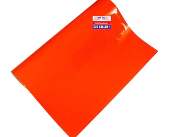 Oranje laken van imitatielakleer voor het maken van haarelastiekjes