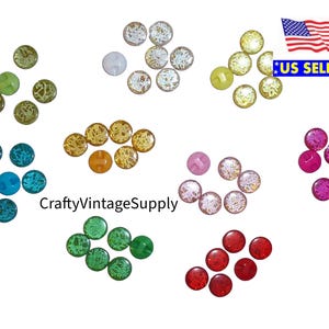 May include: Assortment of colorful glass buttons with various patterns. The buttons are in shades of green, blue, pink, red, and yellow.  CraftyVintageSupply.