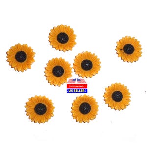 May include: Eight yellow sunflower resin embellishments with black centers. The sunflowers are approximately 1 inch in diameter.