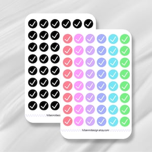 May include: Two rectangular sticker sheets featuring rows of circular checkmark icons. One sheet contains black circles with white checkmarks, while the other features columns of pink, purple, blue, and green circles with white checkmarks. Text reads hibennidesign.etsy.com.