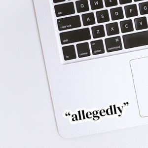 May include: A white laptop computer with a black keyboard and a sticker that says "allegedly" on the bottom right corner.