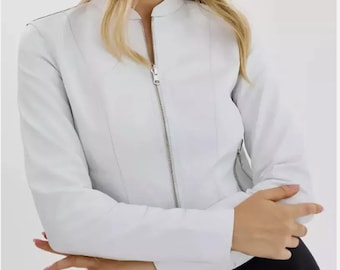 May include: A white leather jacket with a zipper closure. The jacket has a stand-up collar and long sleeves.