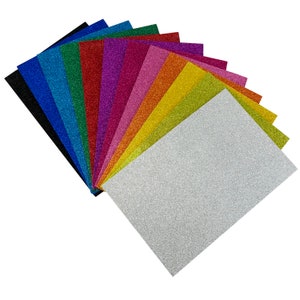 May include: A fan of 12 sheets of glitter paper in various colors, including black, blue, green, red, pink, purple, orange, yellow, and silver.