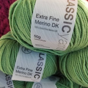May include: Green yarn skeins labeled "Classic Yarns Extra Fine Merino DK 100% Extra Fine Merino DK 50g 125m/137yds 9002707 Made in Romania"