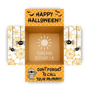 May include: An open cardboard box with orange and white plaid flaps featuring Halloween graphics. The top flap reads HAPPY HALLOWEEN!! with bats. The bottom flap shows a mummy and reads DON'T FORGET TO CALL YOUR MUMMY!. Spiders and webs decorate the side flaps.