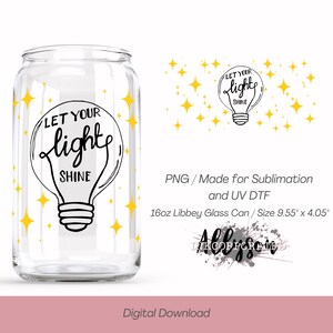 May include: A clear 16oz Libbey glass can with a black and white lightbulb design that reads "LET YOUR light SHINE." The design is surrounded by yellow star shapes. The can measures 9.55" x 4.05".