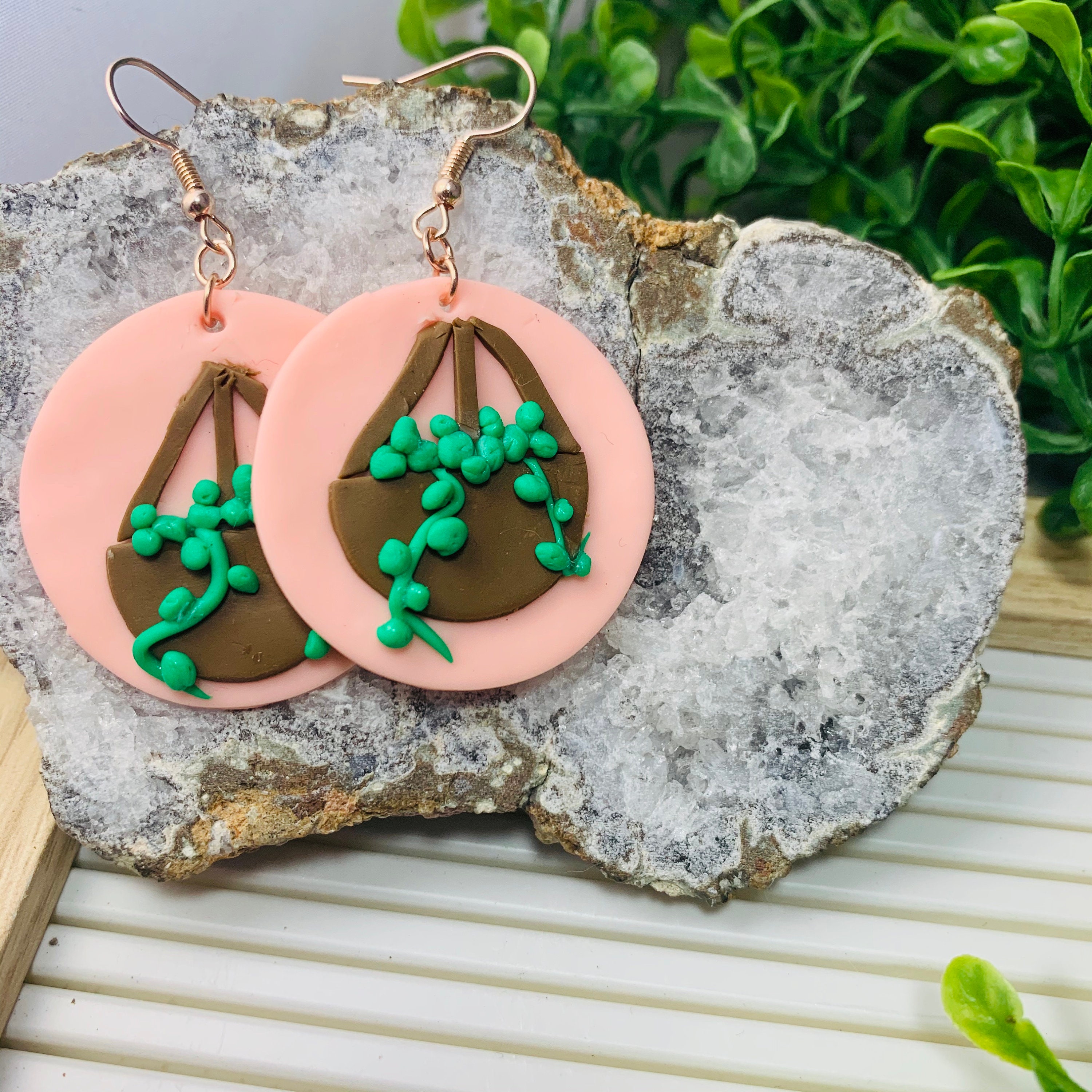 Handmade clay hanging string of beads in plant pot