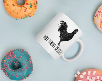 May include: White ceramic coffee mug with a black silhouette of a rooster and the text "Not Today Clucka" printed on the side.