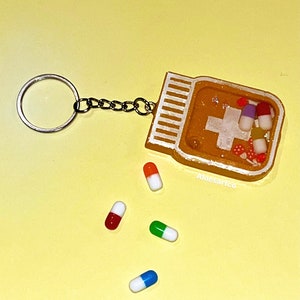 Pill medicine shaker keychain