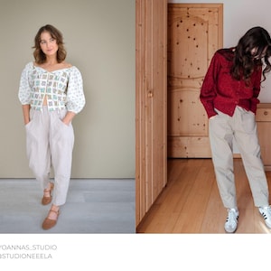 Puede incluir: Dos mujeres con atuendos diferentes. La mujer de la izquierda lleva una blusa con estampado blanco y azul con un pantal&oacute;n beige. La mujer de la derecha lleva una camisa roja de manga larga con un pantal&oacute;n beige.
