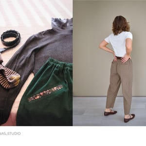 Puede incluir: Un pantal&oacute;n de pana verde con un detalle de estampado floral y un jersey de cuello alto gris. El pantal&oacute;n tiene cintura alta y pierna ancha.