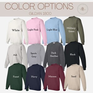 May include: A selection of Gildan 1800 sweatshirts in various colors, including white, light pink, light blue, military green, ash, sports grey, dark heather, black, forest, navy, maroon, and sand.