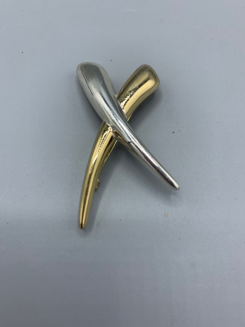 Napier kisses brooch!