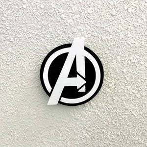 May include: A white and black circle with a white letter A inside. The letter A has an arrow pointing to the right. The circle has a black outline.