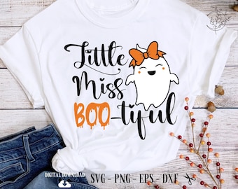 May include: White t-shirt with a black and orange design that says "Little Miss Boo-tiful" with a cute ghost wearing a bow.