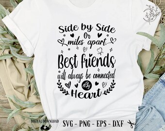 May include: White t-shirt with a black graphic design that reads "Side by Side Or miles apart Best friends will always be connected By Heart".