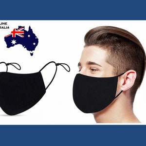 May include: Two black face masks with adjustable ear loops. One mask is being worn by a person, and the other is lying flat. The image includes the text "Topline Australia".