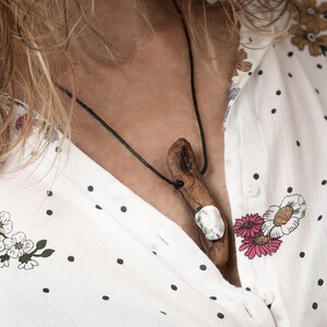 Driftwood necklace embellished with a green and white Moss Quartz
