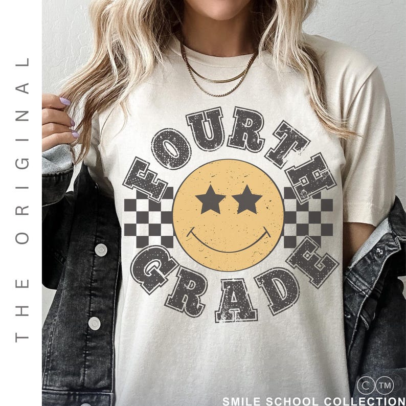 May include: A cream-coloured t-shirt with a retro design. The graphic features a yellow smiley face with star eyes, the words "FOURTH GRADE" in a distressed font, and checkered flag accents. Part of the "SMILE SCHOOL COLLECTION".
