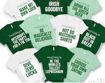 May include: A collection of white, green, and mint-colored t-shirts with various phrases printed on them in a black font. The phrases include "Make My Own Luck," "Irish Goodbye," and "Drink All The Green Beer." The text "The Original Collection" is at the bottom.