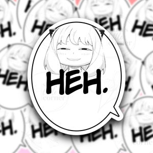 May include: A white sticker with a black outline and a speech bubble. The sticker features a cartoon girl with short hair and cat ears. The text "HEH." is written in bold black letters inside the speech bubble.