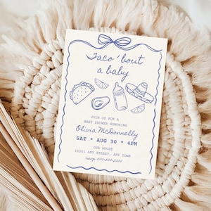 May include: A cream-colored baby shower invitation with blue illustrations of a taco, avocado, baby bottle, and sombrero. The text reads "Taco 'bout a baby" and includes event details: Olivia McDonnelly, August 30th, 4 PM, and an address.