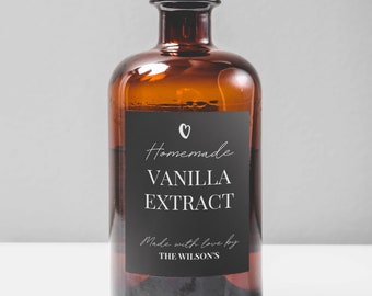 May include: A brown glass bottle with a cork stopper and a black label that reads "Homemade Vanilla Extract Made with love by THE WILSON'S".