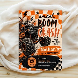 May include: A rectangular birthday invitation card featuring a black monster truck with orange flames, a checkered orange and white background, and the text: smash BOOM CRASH REV YOUR ENGINES FOR Nathan's 5TH BIRTHDAY! SATURDAY 25 JULY AT 3PM MONSTER PARK.