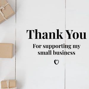 May include: Thank You for supporting my small business. A white wooden surface with several brown cardboard boxes tied with twine.