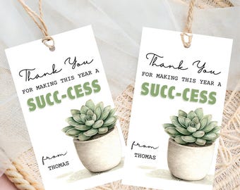 May include: Two white gift tags with a watercolor succulent in a white pot. The tags read "Thank You" and "SUCC-CESS" in green and black text. The tags are tied with twine and say "from Thomas".
