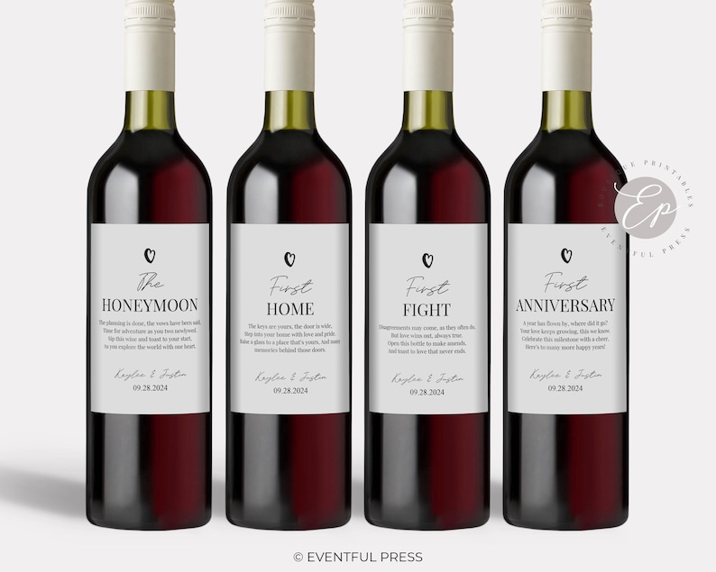 May include: Four wine bottles with white labels featuring black text and a small heart icon. The labels are titled The Honeymoon, First Home, First Fight, and First Anniversary, each including the names Kaylee & Justin and the date 09.28.2024.