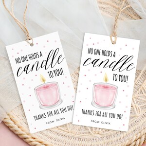 May include: Two white gift tags with the text "NO ONE HOLDS A CANDLE TO YOU! THANKS FOR ALL YOU DO!" and "FROM: OLIVIA". Each tag features a pink candle illustration with a yellow flame and pink polka dots.
