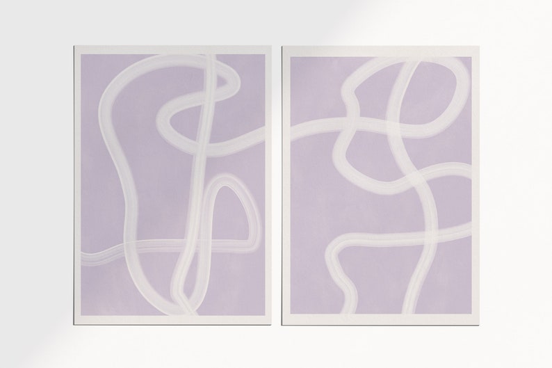 May include: Two abstract art prints with a light purple background and white lines. The lines are curved and create a flowing, organic design.