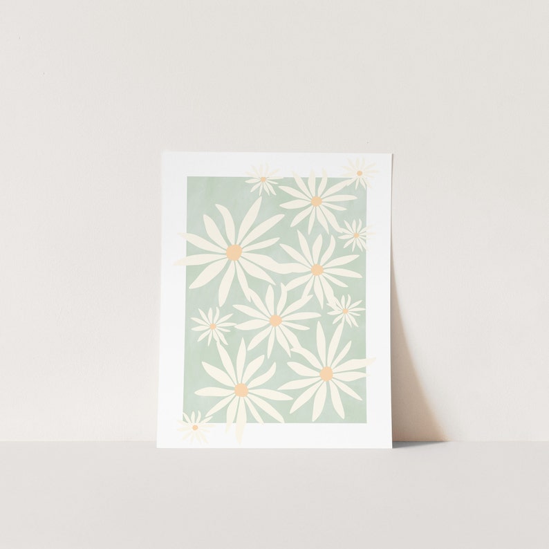 May include: A digital art print featuring a pattern of white daisies with yellow centers on a light green background.