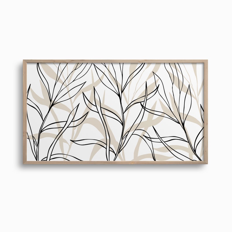 Puede incluir: Una impresi&oacute;n art&iacute;stica bot&aacute;nica enmarcada con un dise&ntilde;o minimalista. La obra presenta dibujos lineales negros de hojas y tallos sobre un fondo blanco, con sutiles formas de hojas beige. El marco es de madera clara.