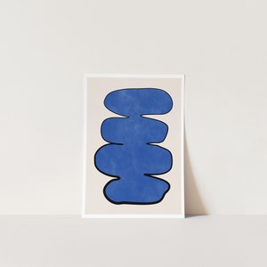May include: Abstract art print featuring a stack of five blue organic shapes on a beige background.