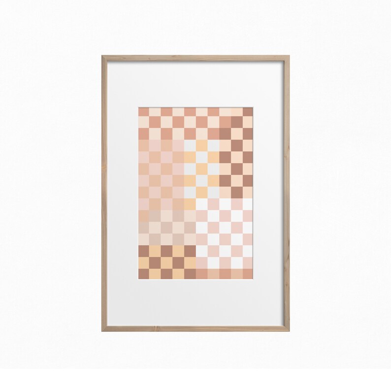 May include: A framed print with a geometric pattern of squares in shades of pink, peach, and beige.