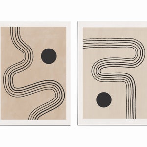 Puede incluir: Dos impresiones de arte abstracto con fondo beige y l&iacute;neas negras que forman un patr&oacute;n ondulado. Cada impresi&oacute;n presenta un c&iacute;rculo negro.