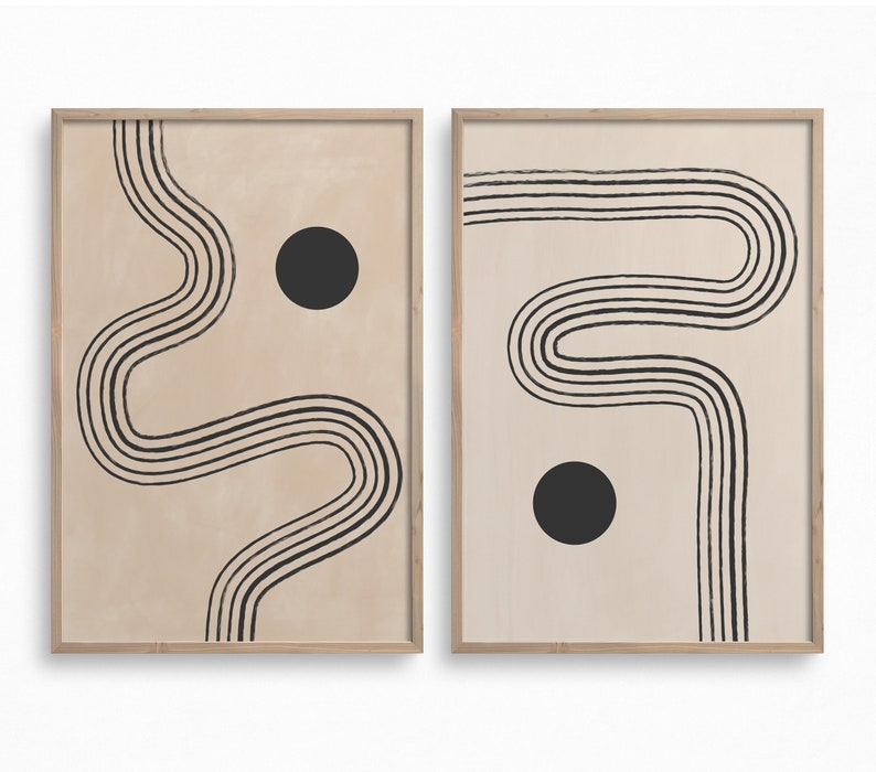 Puede incluir: Dos impresiones enmarcadas con un fondo beige y dise&ntilde;os abstractos de l&iacute;neas negras. Cada impresi&oacute;n presenta un c&iacute;rculo negro.