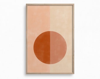 May include: A framed abstract art print with a large orange circle divided in half by a vertical line. The background is a light peach color.