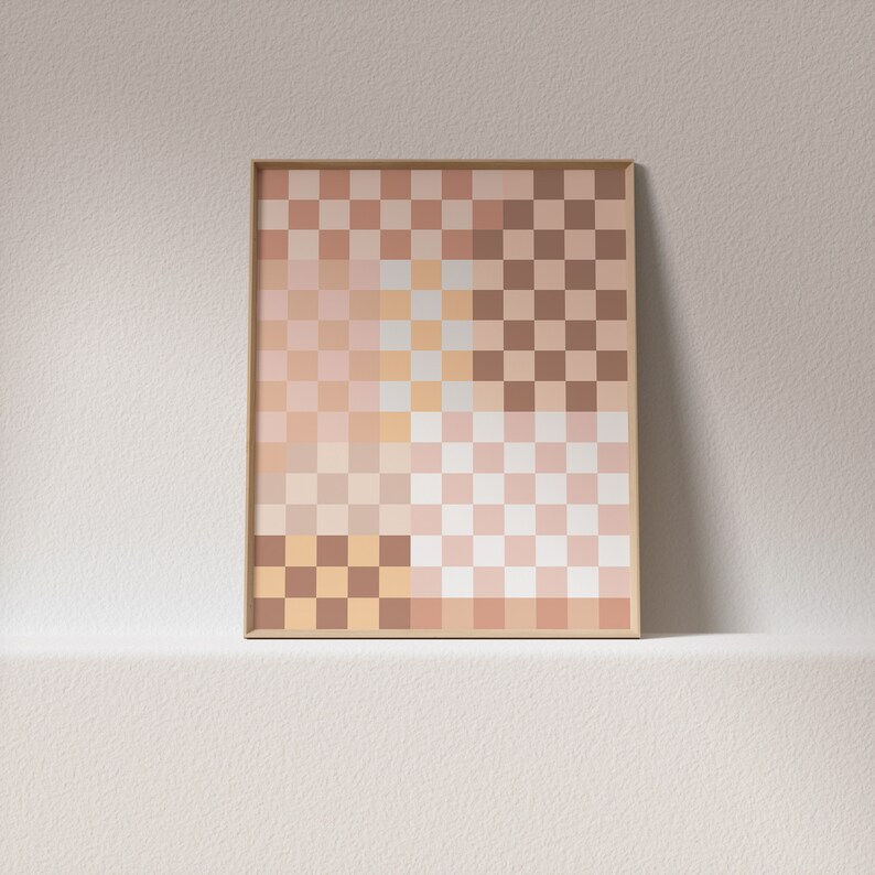 May include: A framed abstract art print with a checkered pattern in shades of beige, brown, and pink.