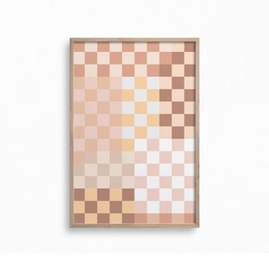 May include: A framed abstract art print with a checkered pattern in shades of brown, pink, and white.