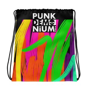May include: A black drawstring bag with a colorful abstract design and the text "PUNK DEM NIUM!" in white.
