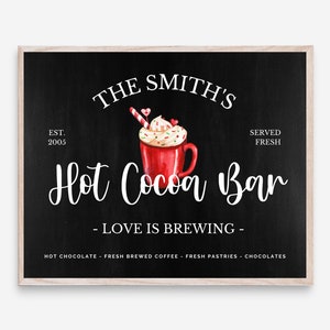 May include: A black chalkboard sign with white text that reads "The Smith's Est. 2005 Hot Cocoa Bar - Love is Brewing - Hot Chocolate - Fresh Brewed Coffee - Fresh Pastries - Chocolates" with a watercolor illustration of a red mug of hot cocoa with whipped cream, candy canes, and sprinkles.