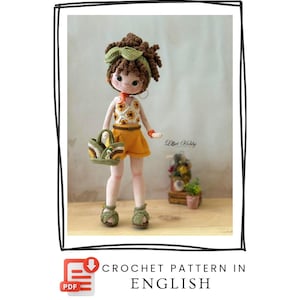 May include: A handmade crochet doll with brown hair, wearing a yellow skirt and top with sunflower details. The doll has green sandals and a matching purse. The text "CROCHET PATTERN IN ENGLISH" is displayed below the image.