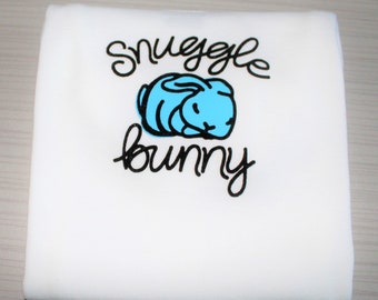 Baby boys' white long sleeved "Snuggle Bunny" bodysuit with blue baby bunny.