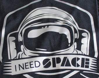 Boys 100% cotton t-shirt with 'I need space' lettering and graphic spaceman design.