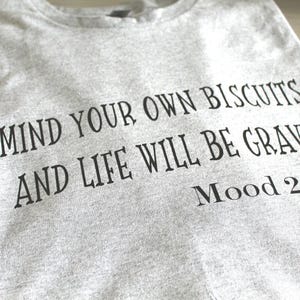 Men&#39;s/Women&#39;s short-sleeved cotton t-shirt with &#39;Mind your own biscuits and life will be gravy&#39; wording.